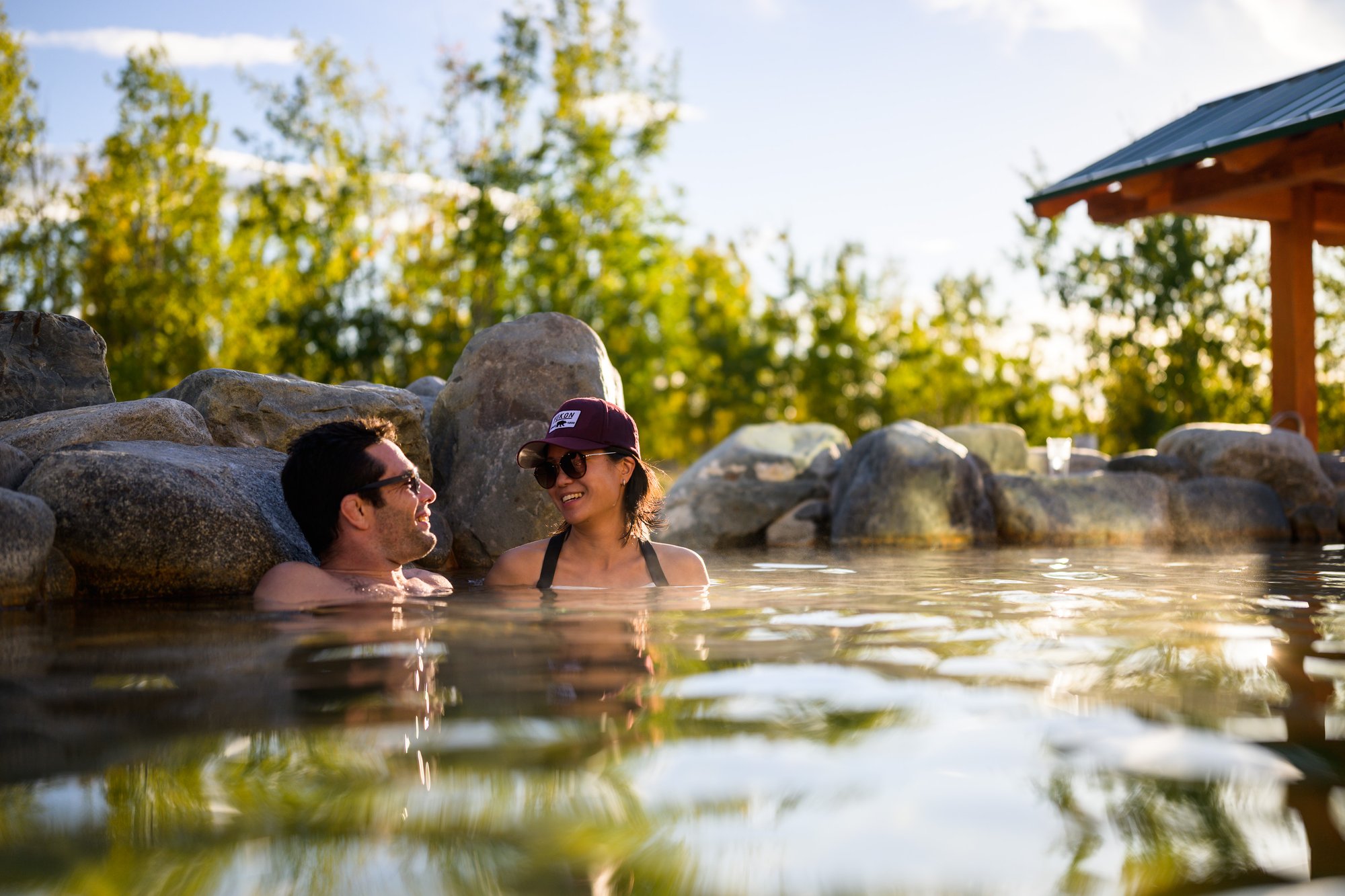 couple soak in the Japanese onsen-inspired Eclipse Pool at Eclipse Nordic Hot Springs YG_TC_20220910_6859