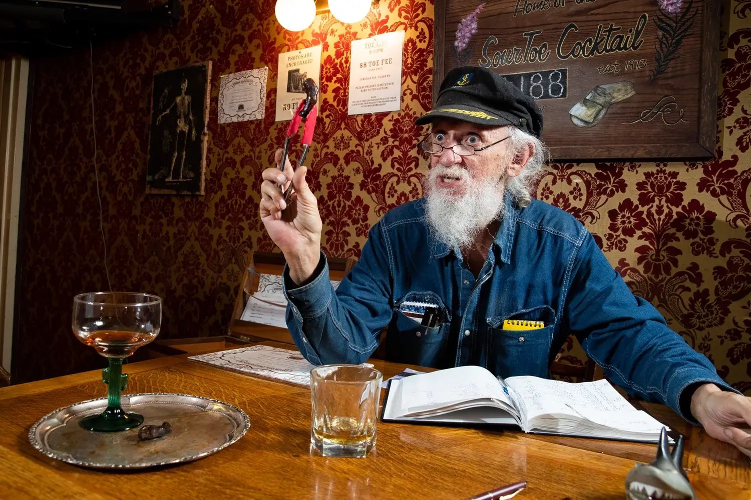 Guests taking part in the Sourtoe Cocktail tradition in Dawson City.
