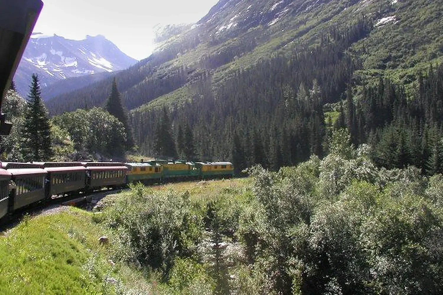 White Pass train winding through mountain scenery on the historic route between the Yukon and Alaska.