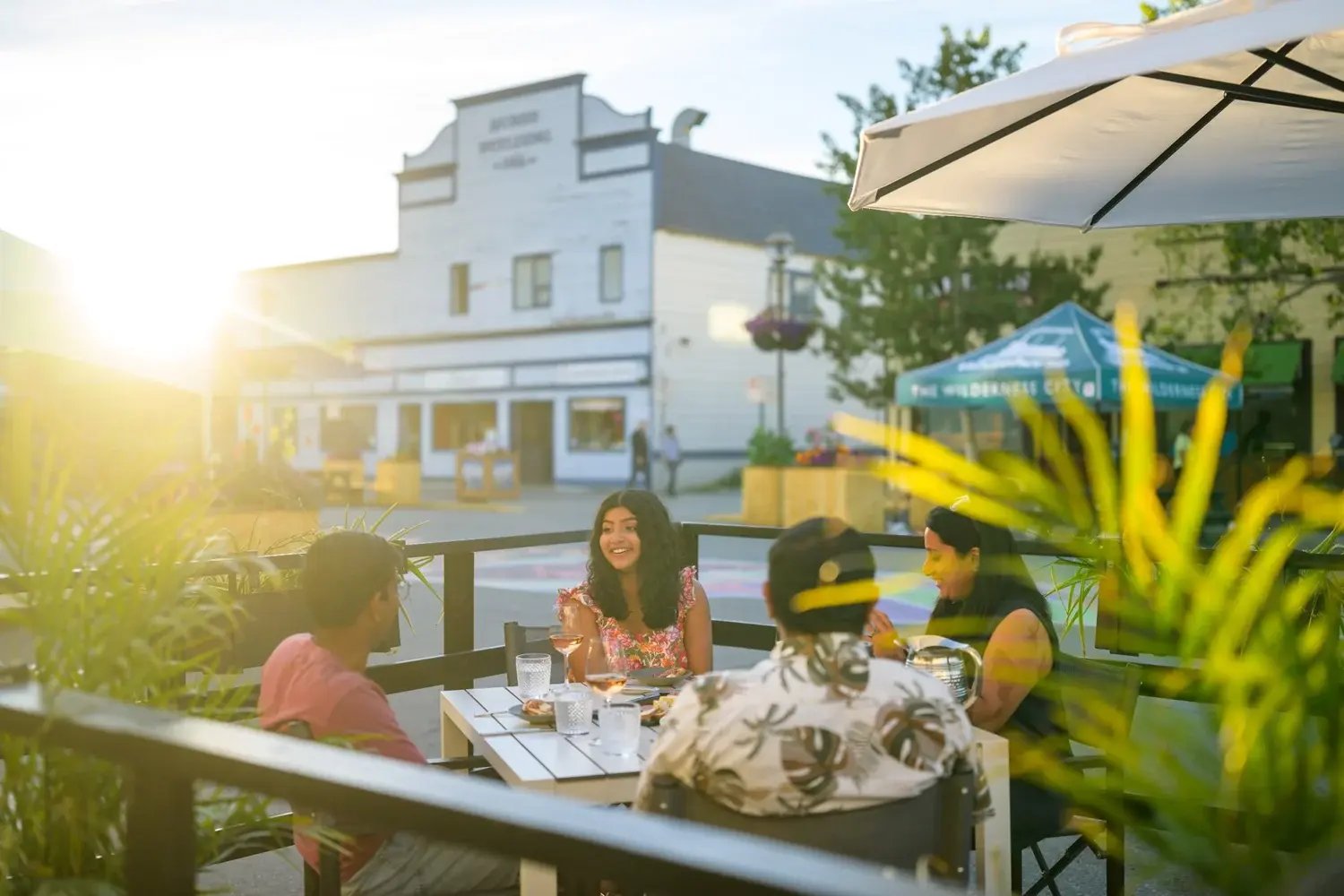 Guests enjoying patio dining in Whitehorse on a long summer evening.