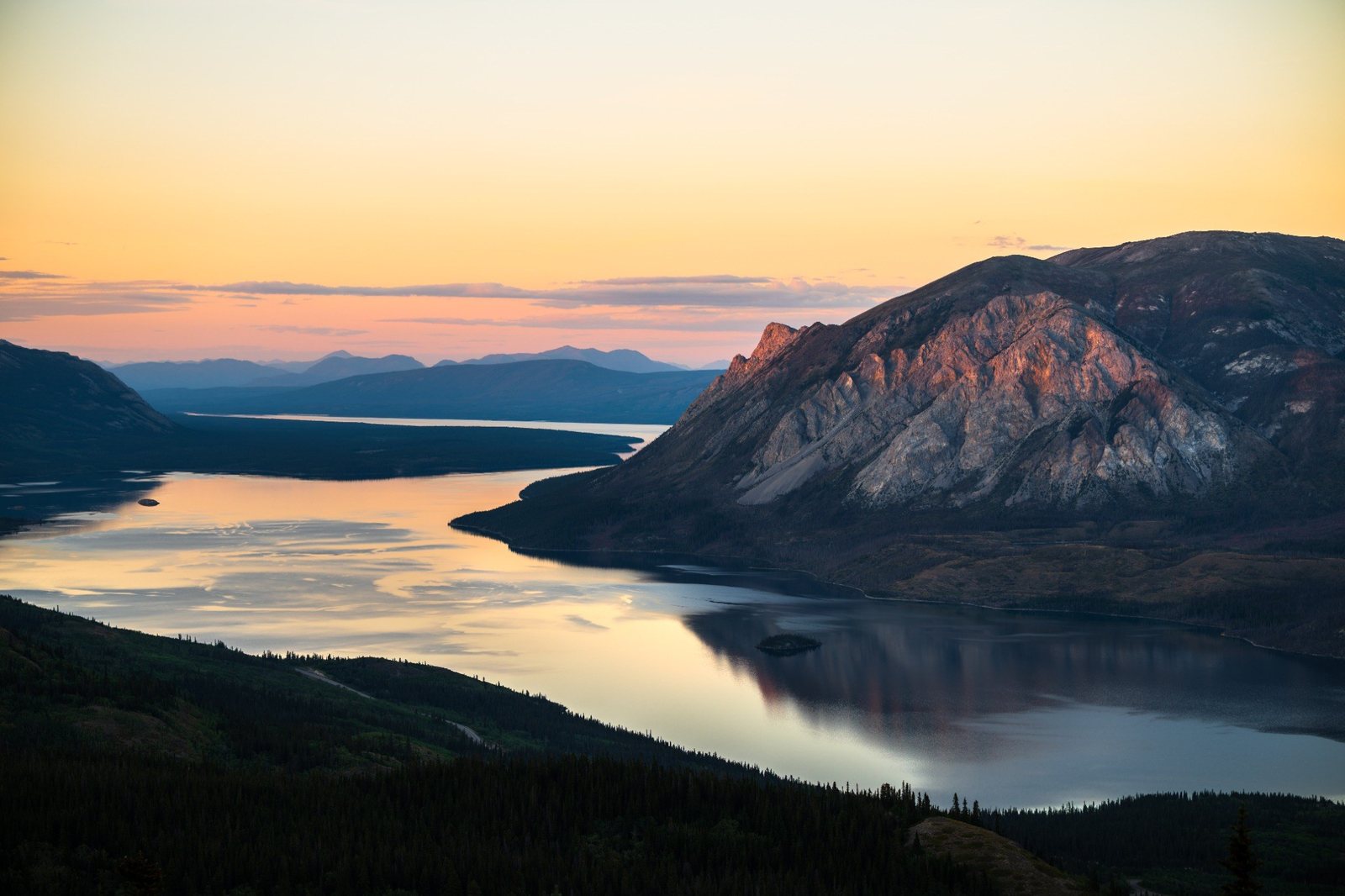 Alpenglow on the limestone cliffs above Windy Arm on Tagish Lake in Yukon.