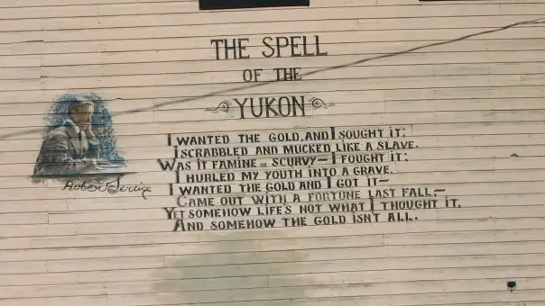 The Spell of the Yukon poem painted on a building in Dawson City